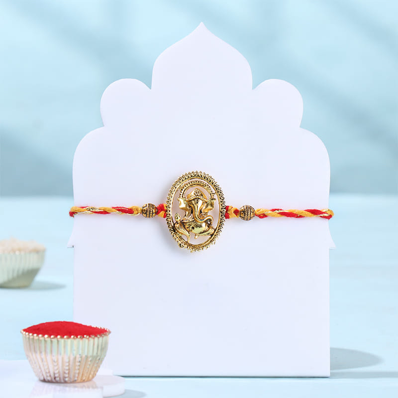 Divine Ganesha Rakhi With Chana Badam Bite