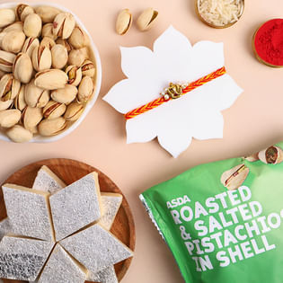 Divine Ganesha Rakhi With Sweets And Nuts