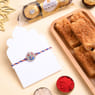 Divine Ganesha Rakhi With Sweets N Chocolates