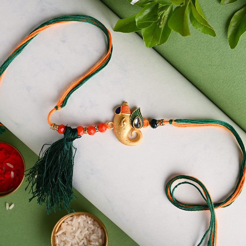 Order Divine Golden Ganesha Rakhi Online - Divine Rakhi 