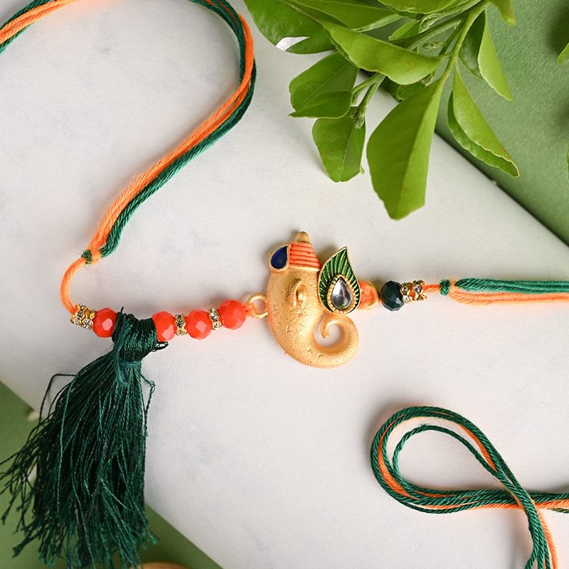 Send Divine Rakhi Online - Divine Golden Ganesha Rakhi