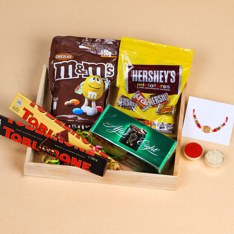 Divine Om Rakhi N Chocolate Extravaganza Hamper