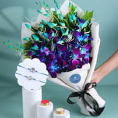 Divine Rakhi Duo With Blue Orchids Bouquet