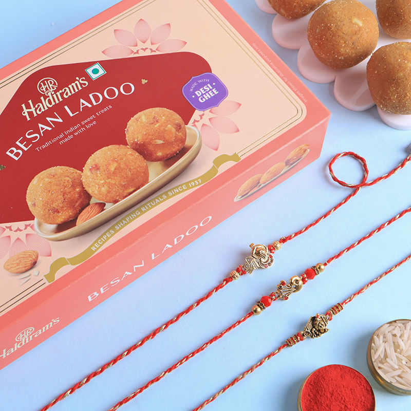 Divine Rakhi Set Of Three With Besan Ladoos
