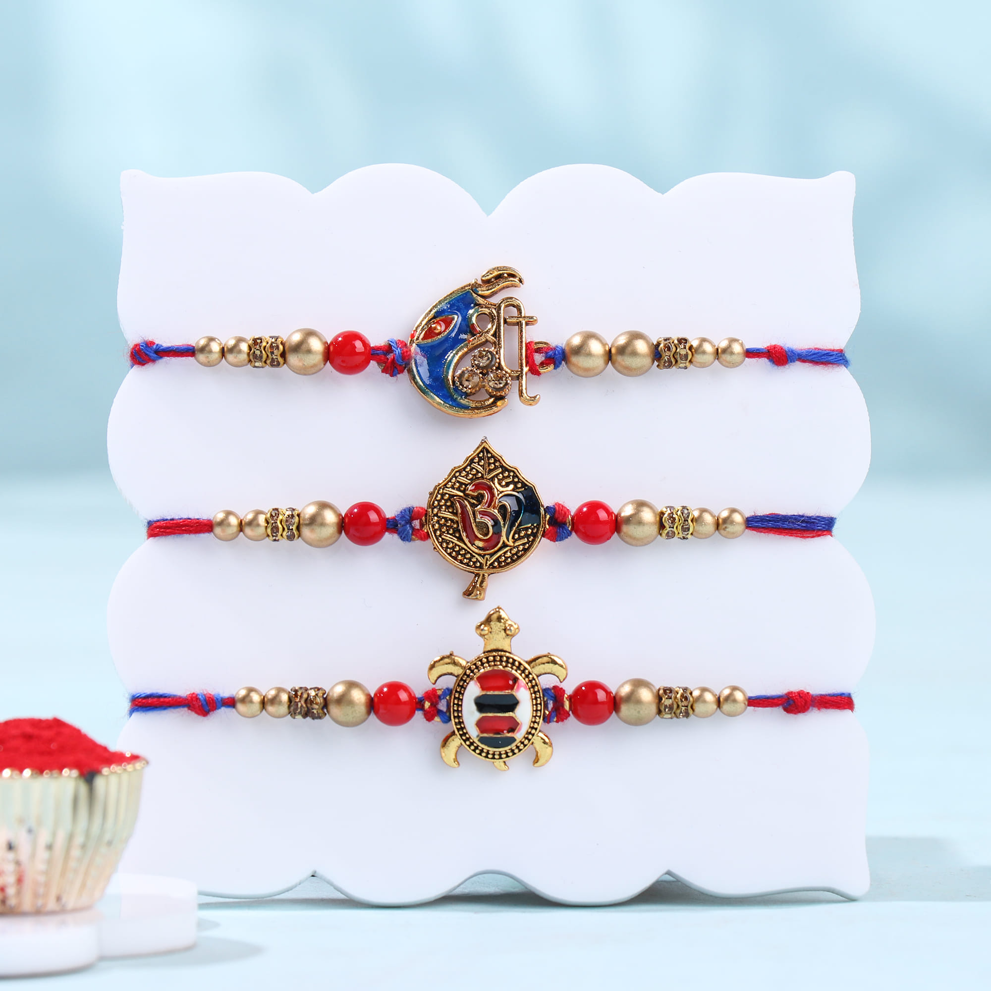 Divine Stone Rakhi Trio With Savoury Treats