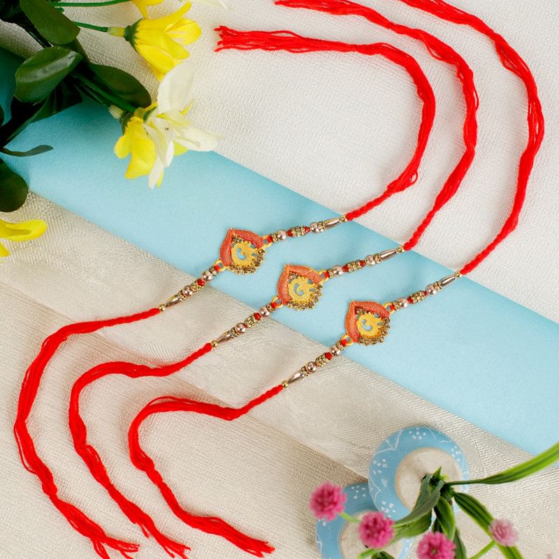 Divine Trio Of Golden Om Rakhis