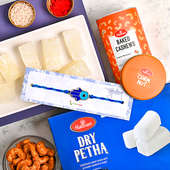 Order Fancy Rakhi for Brother with Sweets & Dry Fruits - Delicious Dry Petha With Healthy Baked Cashews And Blue Good Luck Rakhi