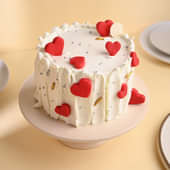 Round Cream Cake with Heart-Shaped Red Velvet Cake on Top