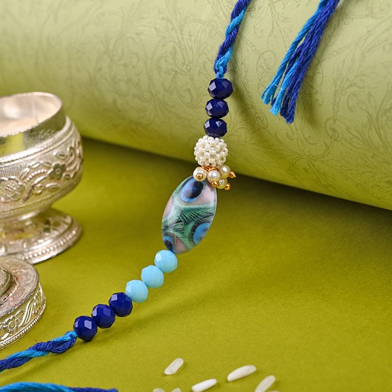 Elegant Blue Beaded Rakhi: Peacock Rakhi Delivery in Germany