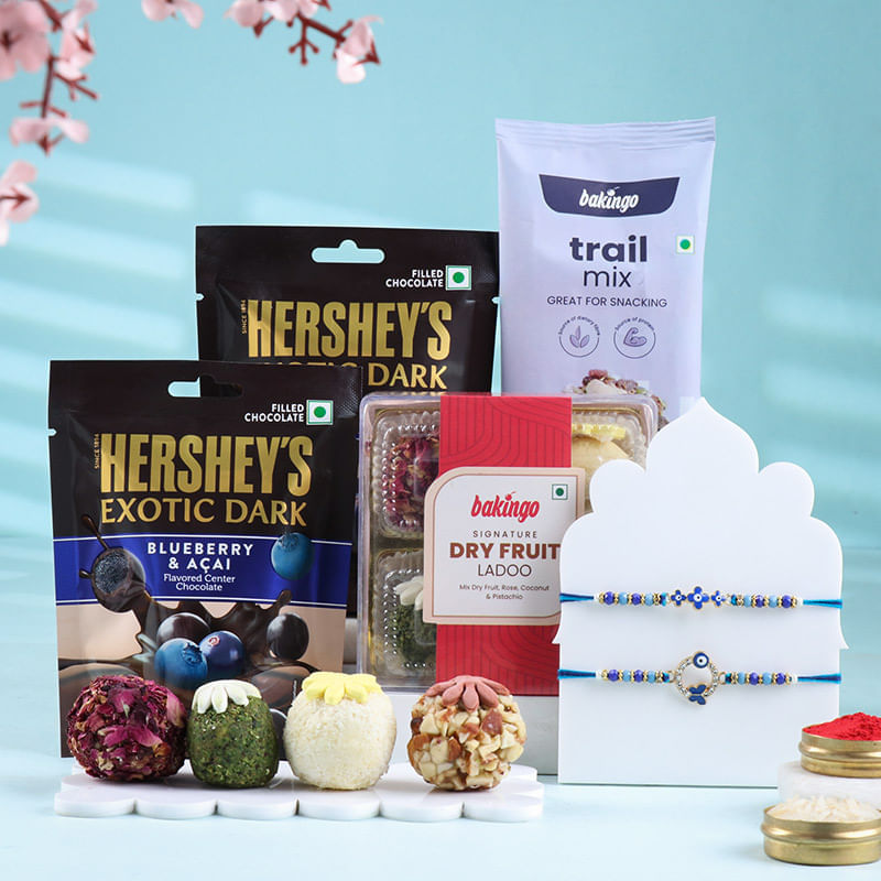 Elegant Evil Eye Rakhi Duo With Sweets N Nuts