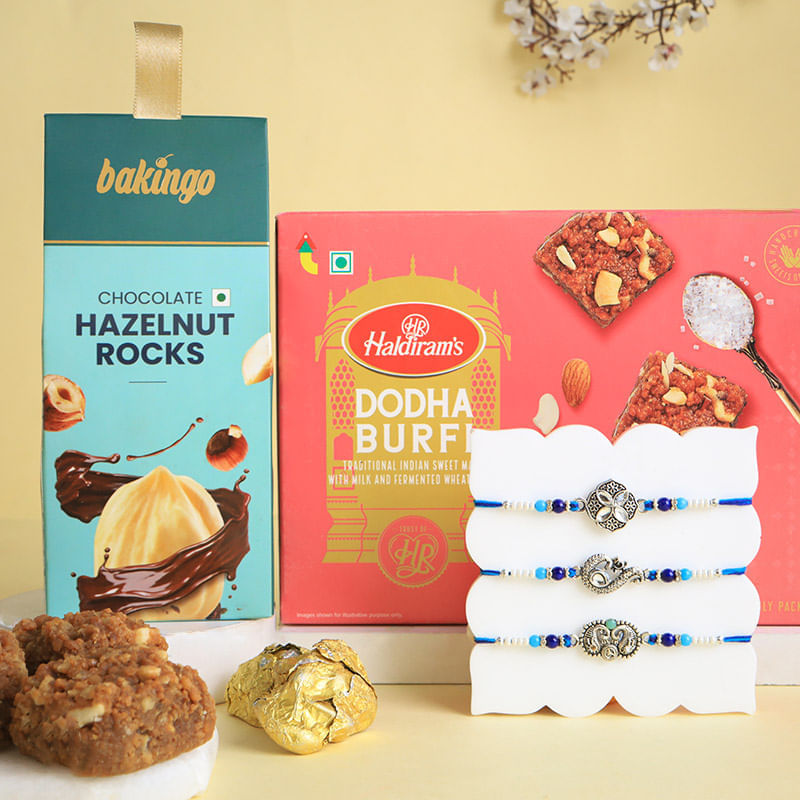 Elegant Floral Motif Rakhis Trio With Sweet Bites
