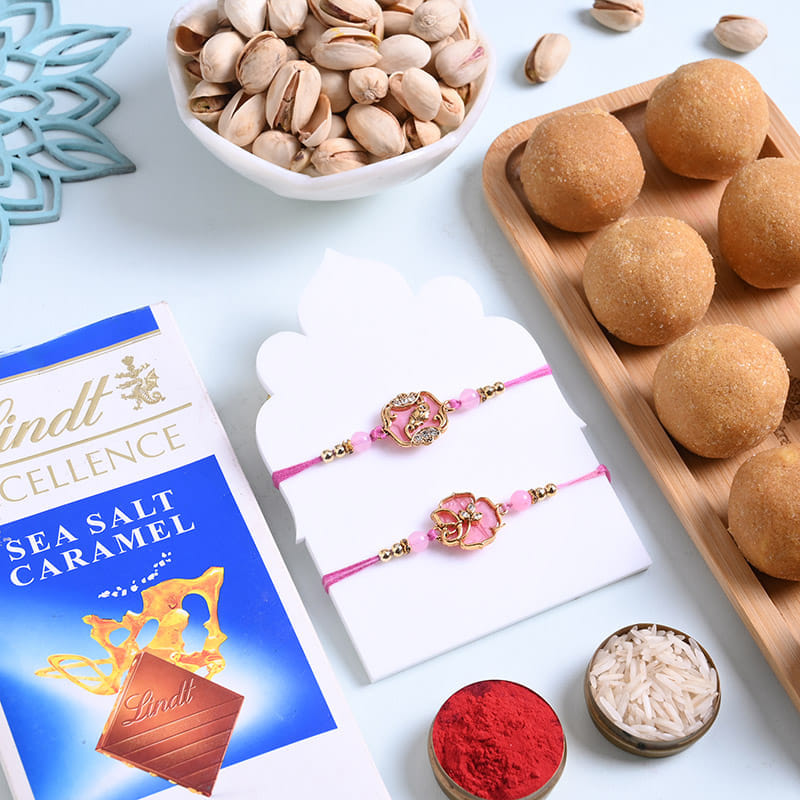 Elegant Floral Rakhi Duo With Sweets N Nuts