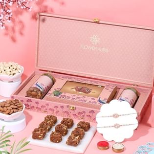 Elegant Rakhi Trio With Sweets N Nuts Hamper