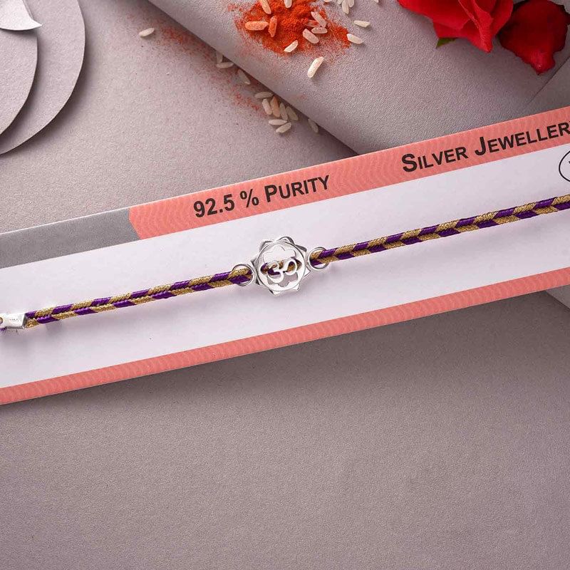 Embellished Aum Bracelet Rakhi in Packing