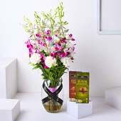 Enchanting Combo Of Orchids Carnations N Chocolates