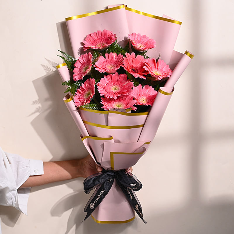 10 Pink Gerberas In Pink Premium Paper: Teachers Day Flowers