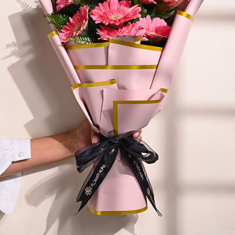 10 Pink Gerberas In Pink Premium Paper: Teachers Day Flowers