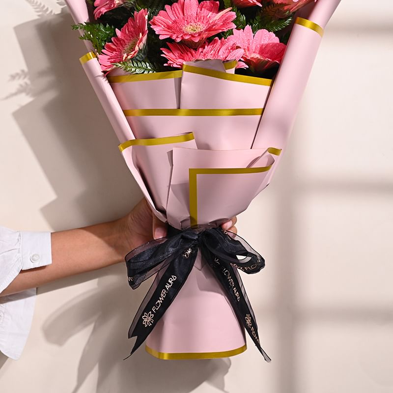 10 Pink Gerberas In Pink Premium Paper: Teachers Day Flowers