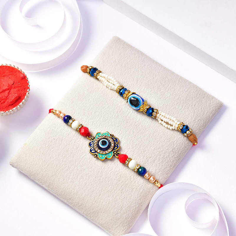 Evil Eye Beaded Rakhi Duo With Festive Munchies