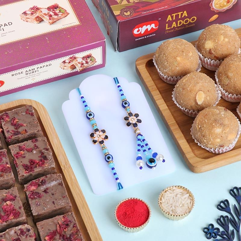 Evil Eye Floral Bhaiya Bhabhi Rakhis With Sweets