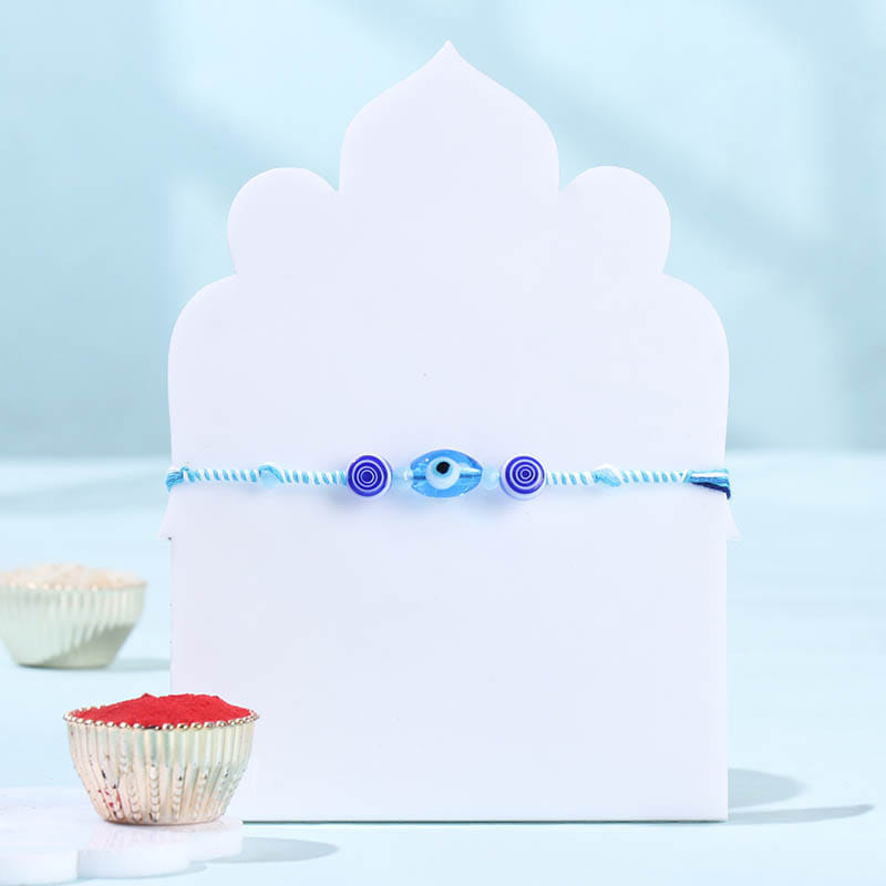 Evil Eye Stone Rakhi With Kaju Katli
