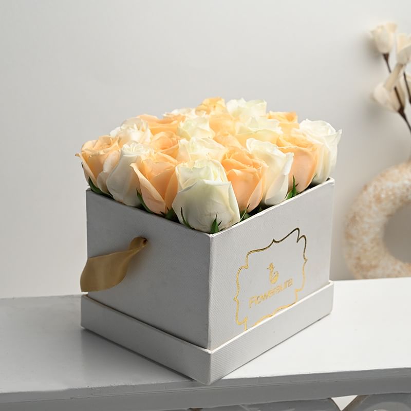 Arrangement of 20 Peach and White Roses in White Floweraura Box