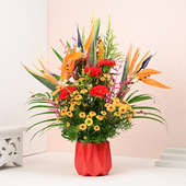 Exquisite Floral Harmony In Red Vase