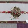 Antique Metal Rakhi With Red Beads