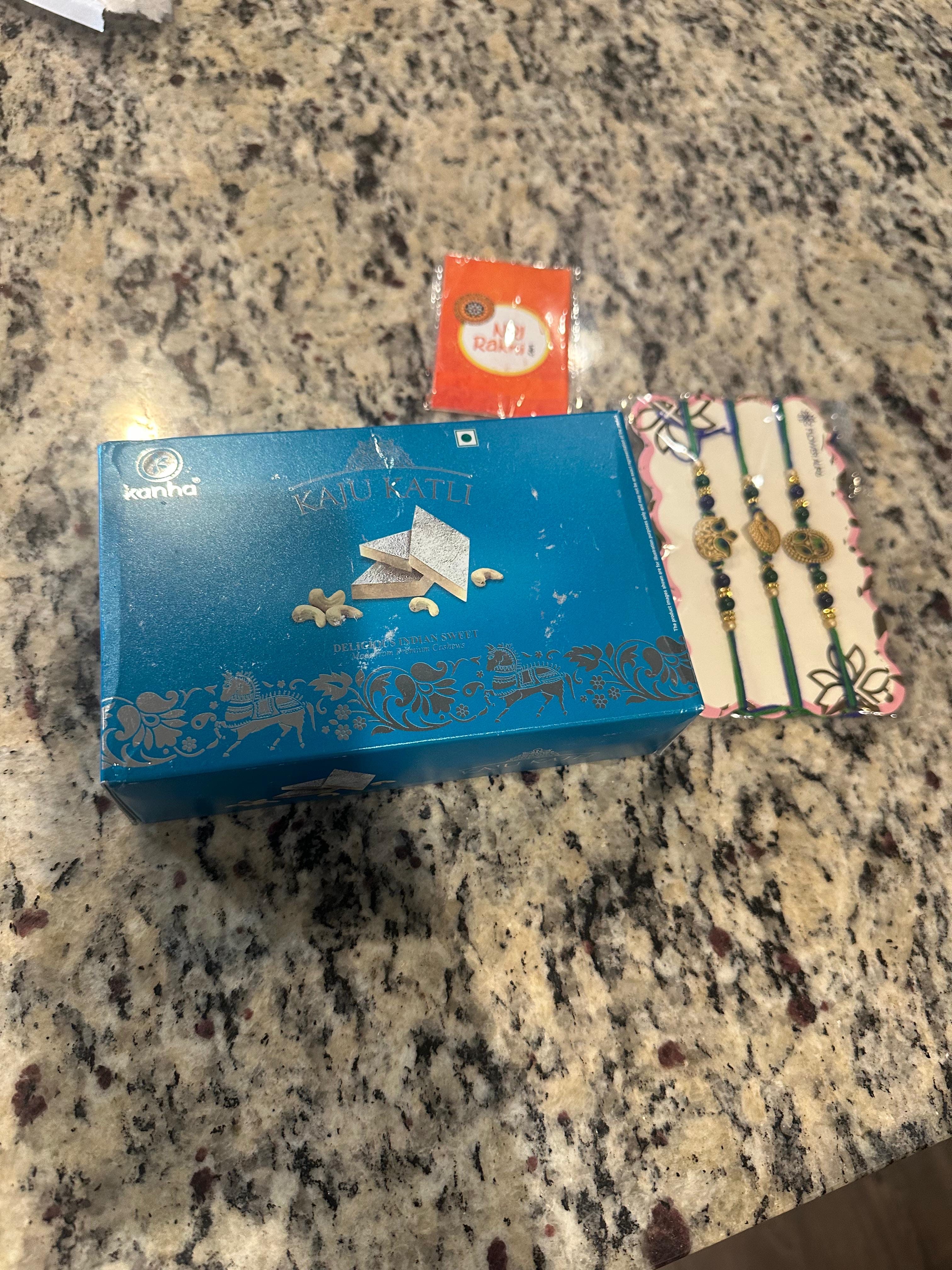 Three Peacock Charm Rakhis With Kaju Katli