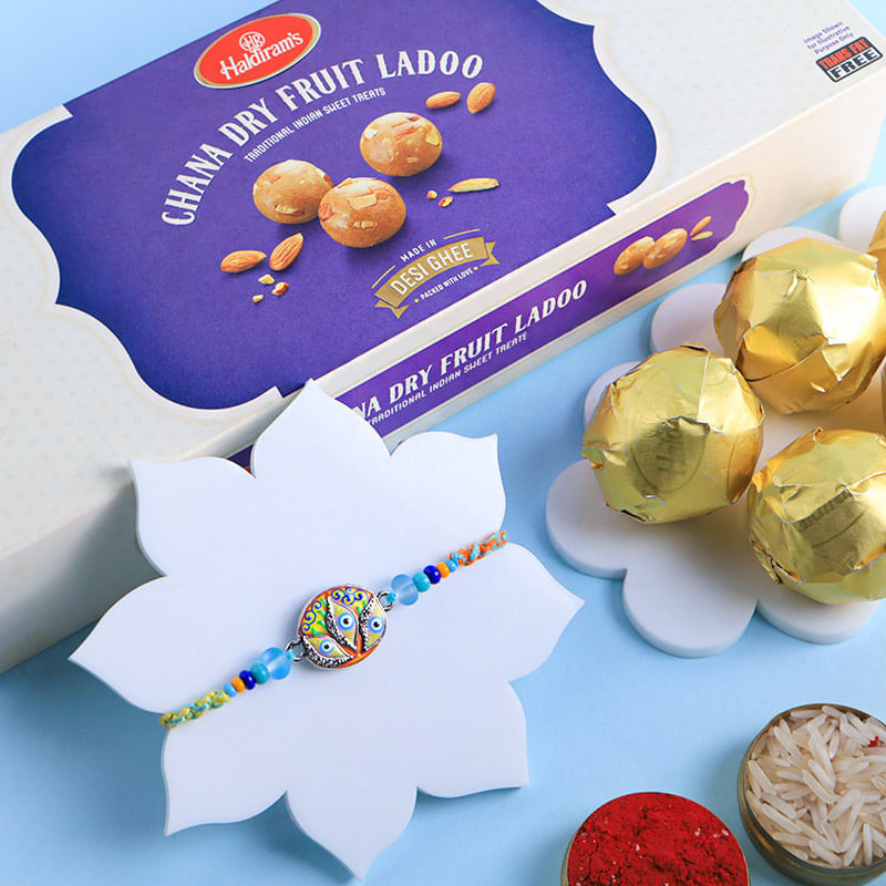 Fancy Evil Eye Rakhi With Chana Ladoo