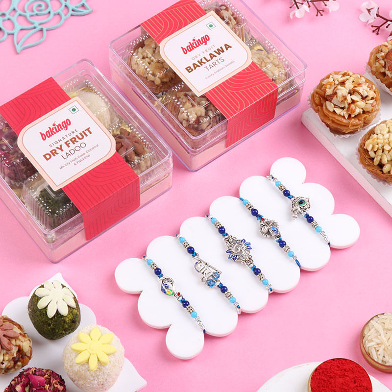 Five Silver Charm Rakhis With Gourmet Ladoo N Tarts