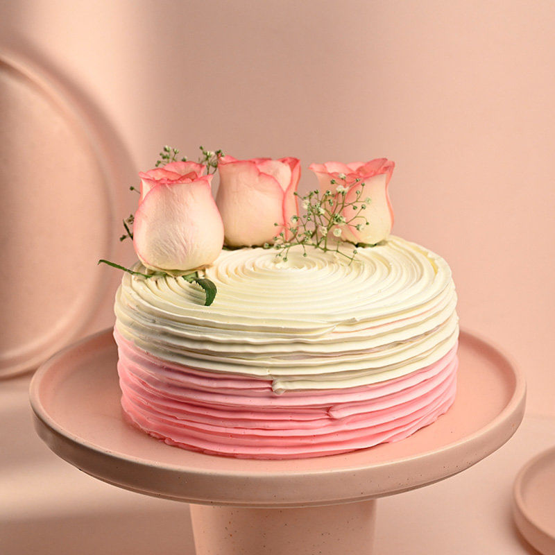 Side view of Flavorful Rose Adorned Cake