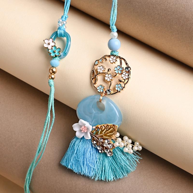 Close view of Floral Couple Luma Rakhi 