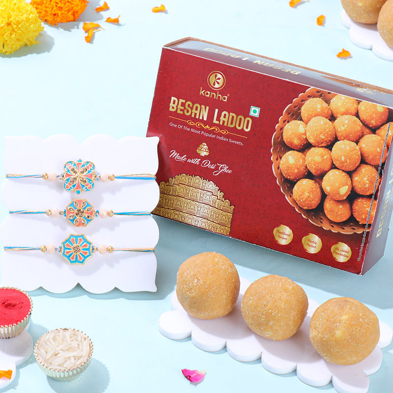 Floral Pastel Rakhi Trio With Besan Ladoos