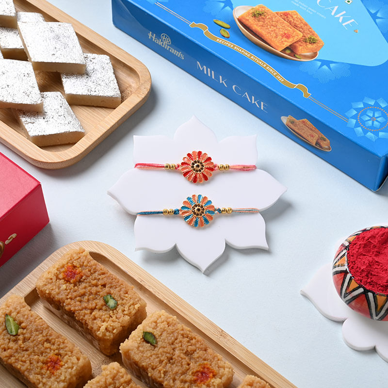 Set of 2 Floral Rakhi Duo with Delightful Kaju Katli N Milk Cake