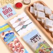 Floral Rakhi Trio With Sweet N Nutty Treats