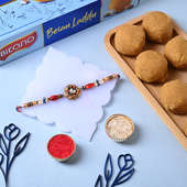 Floral Rakhi With Gemstone N Laddu - Order Now