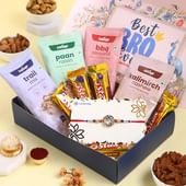 Floral Rakhi With Savoury N Sweet Delights Hamper