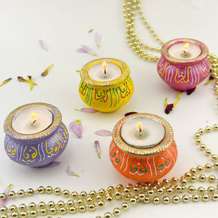 Four Glowing Diwali Matki Diyas