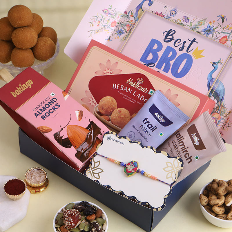 Ganesha Kids Rakhi With Ladoos N Nuts Hamper