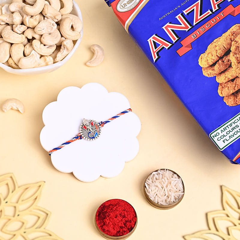 Ganesha Rakhi With Cashews N Biscuits