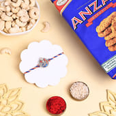 Ganesha Rakhi With Cashews N Biscuits