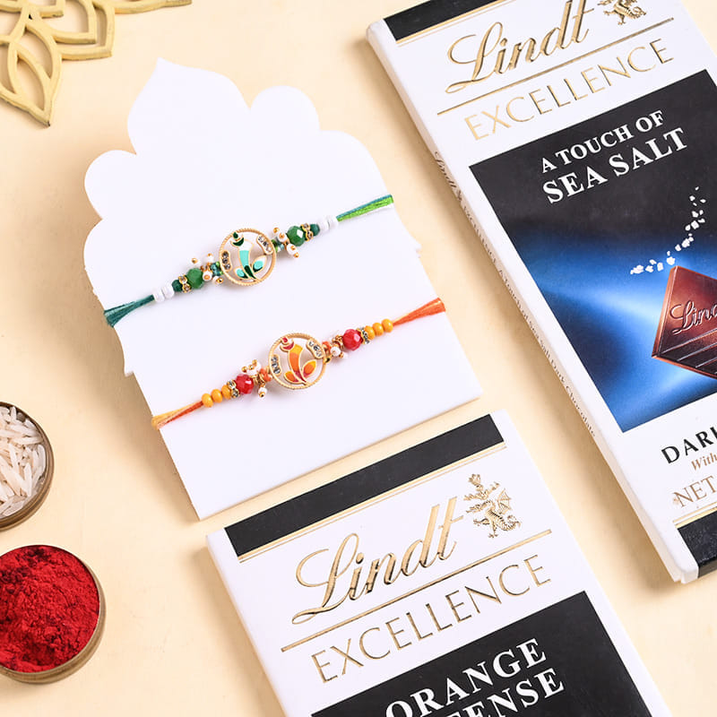 Golden Charm Rakhi Duo With Lindt Choco Bars