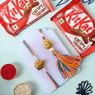 Golden Ganesha Bhaiya Bhabhi Rakhis With Kitkat Chocolates