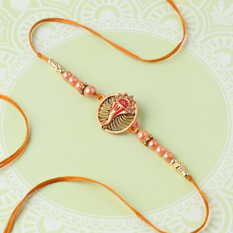 One Designer Rakhi - Golden Ganesha Rakhi