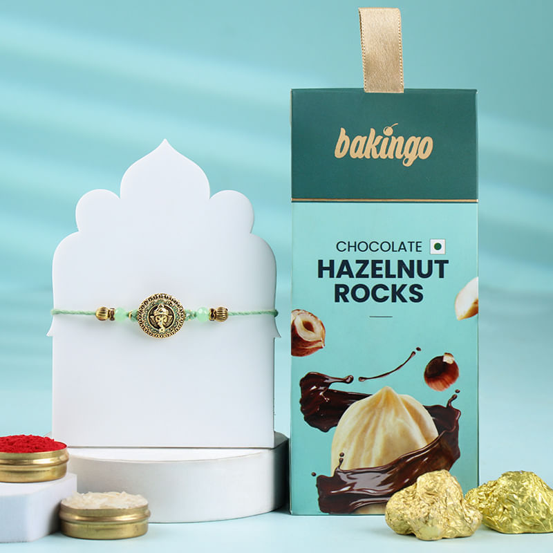 Golden Ganesha Rakhi With Choco Hazelnut Rocks-Overseas