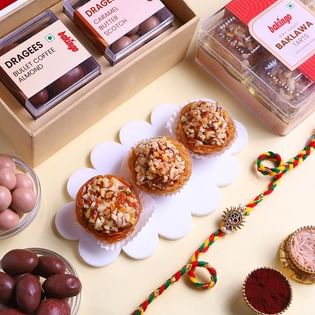 Golden Om Rakhi With Sweet Bites