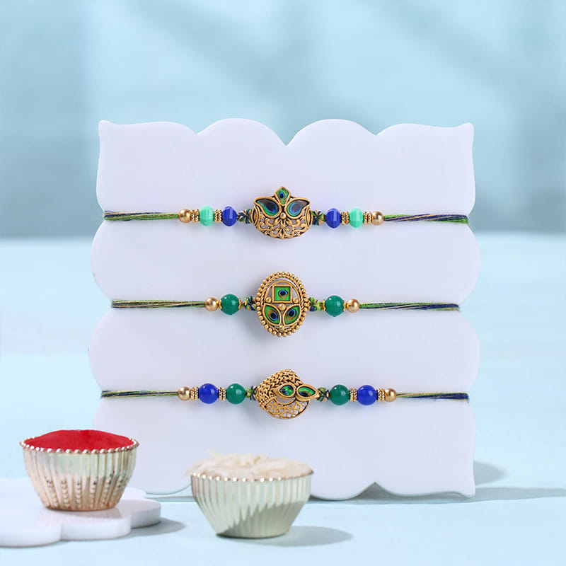 Golden Peacock Rakhi Trio With Kaju Katli