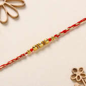 Golden Bead and Pearl Thread Rakhi