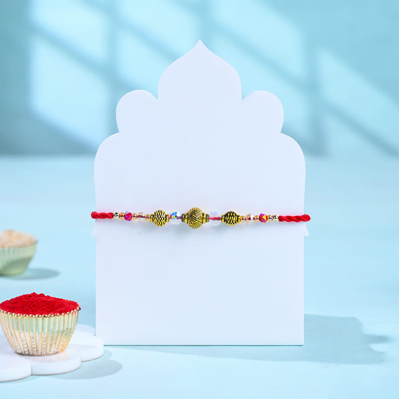 Golden Pearl Rakhi With Gourmet Treats